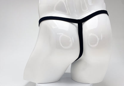Back view of a purple WildmanT modal micro thong with a thin waistband on a glossy white mannequin torso.