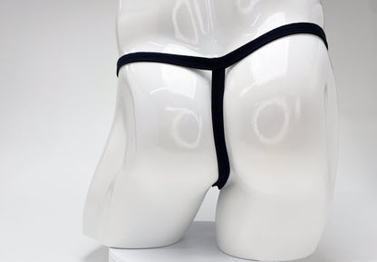 Back view of a white male mannequin wearing a black WildmanT micro thong with thin side straps.