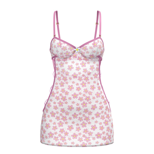 White floral magic silk dress with pink and yellow flowers, thin pink straps, and ruffled hem detail
