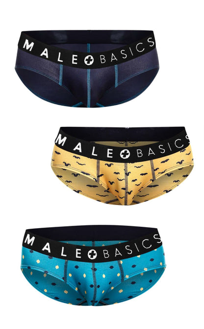 Three pairs of male basics brief prints stache underwear in navy with teal stitching mustard with black mustaches and turquoise polka dots