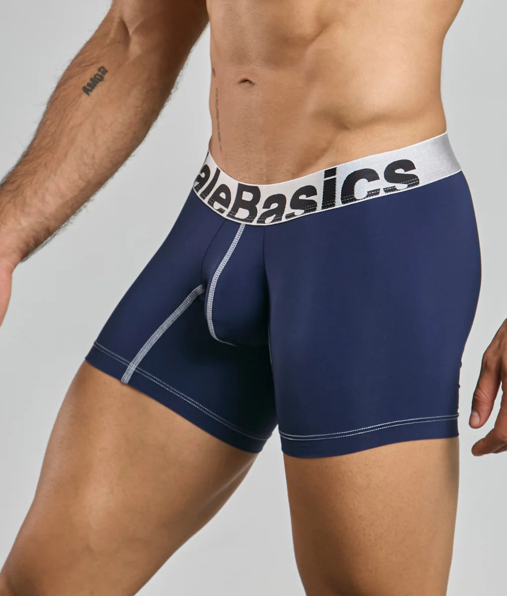 Navy blue male basics microfiber boxer brief with white elastic waistband and black alebasics branding and gray stitching