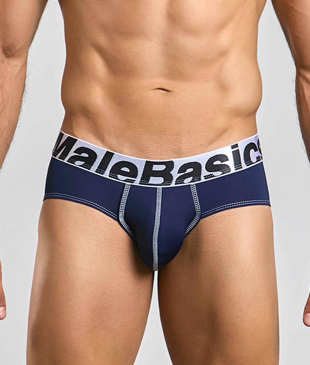 Navy blue male basics microfiber briefs with white elastic waistband, black lettering, and light gray seam stitching