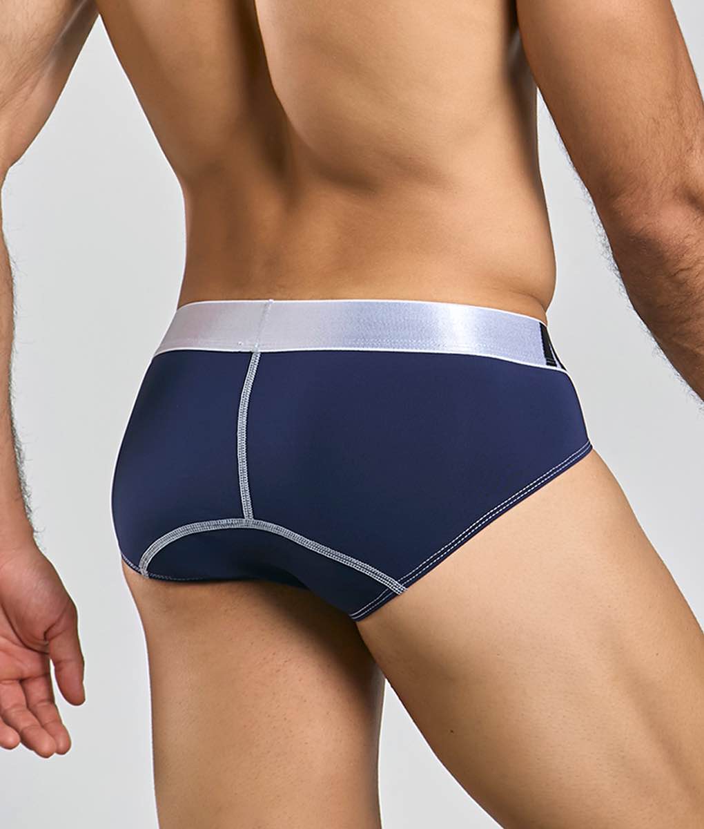 Navy blue microfiber malebasics briefs with silver waistband and matching stitching details front view