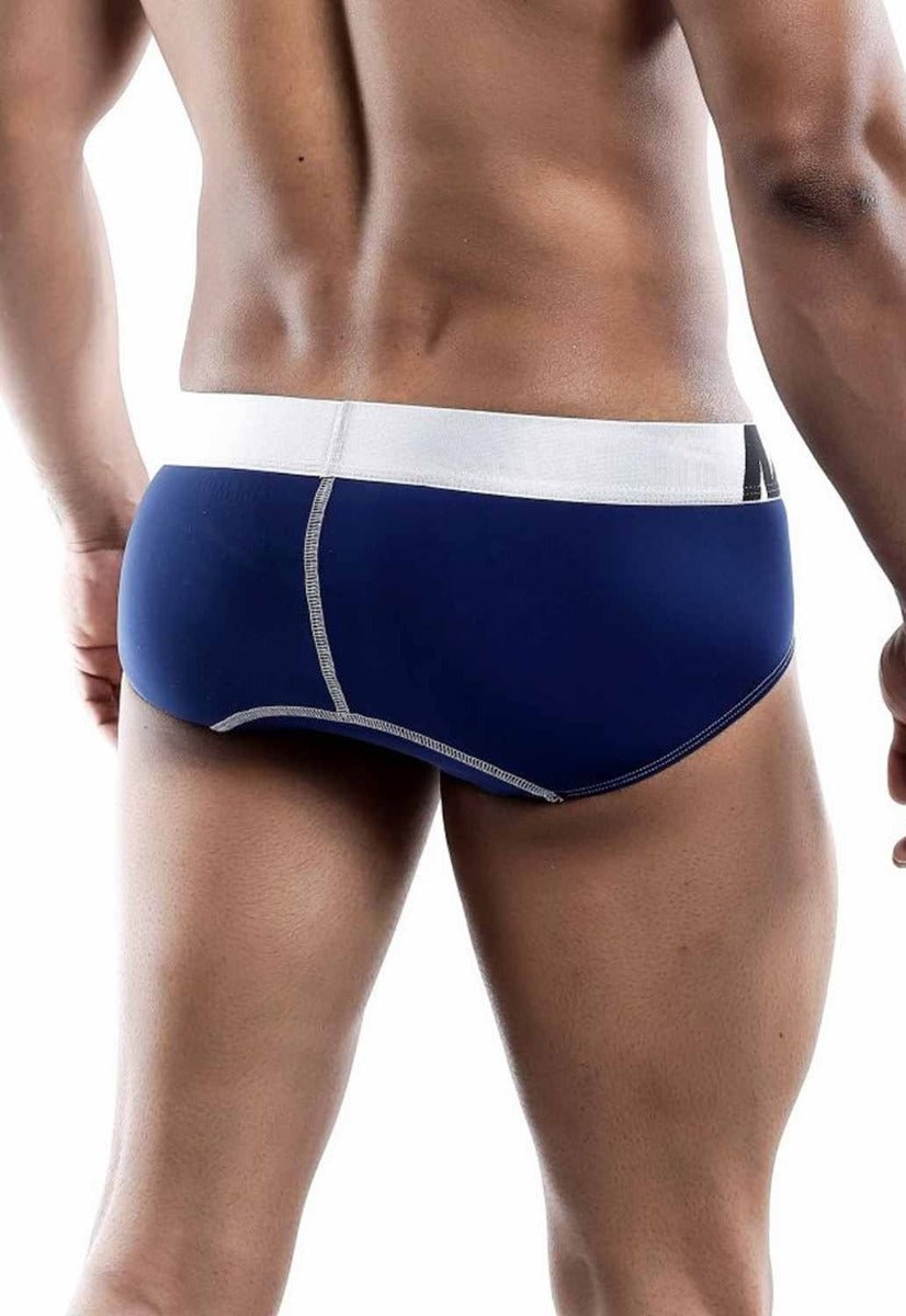 Navy blue MaleBasics microfiber briefs with white waistband and silver stitching along the seams