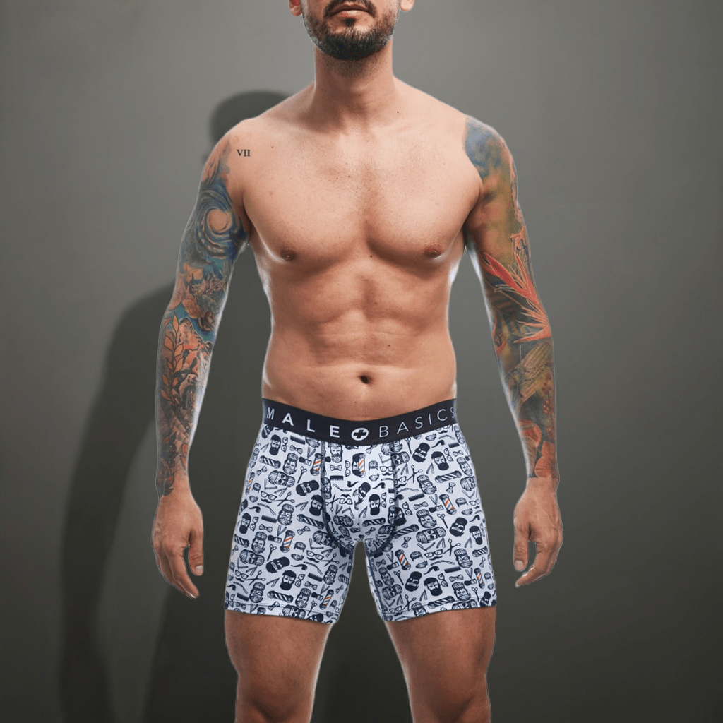 White boxer briefs with black and white facial expression graphic print and male basic waistband labeled malebasics boxerbrief barber skulls