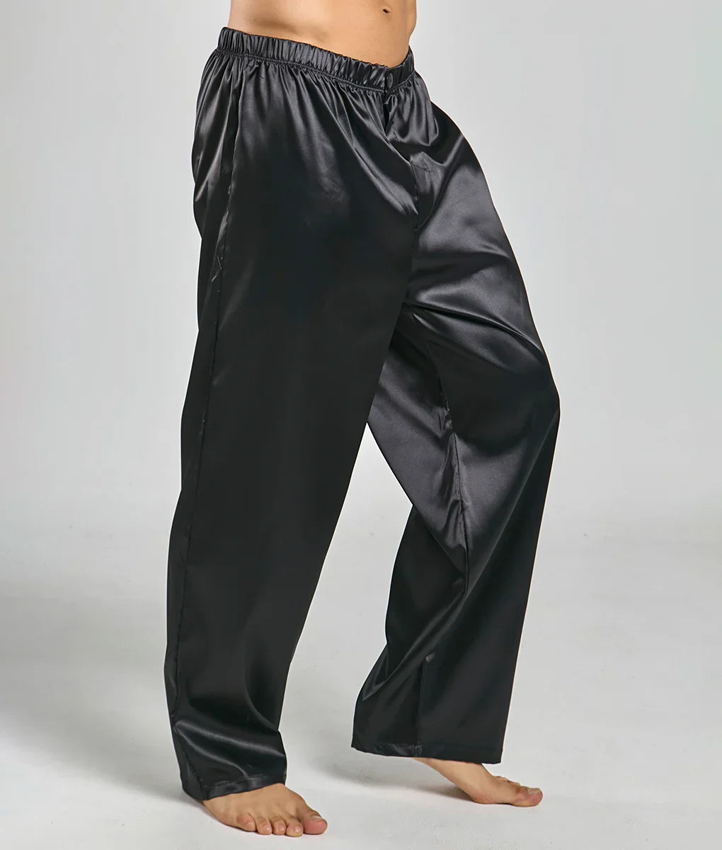 Black satin malebasics pants with elastic waistband and wide legs designed for comfortable lounging or sleepwear