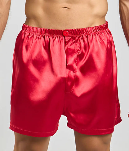 Vibrant red satin malebasics shorts with button closure and elastic waistband for comfortable wear