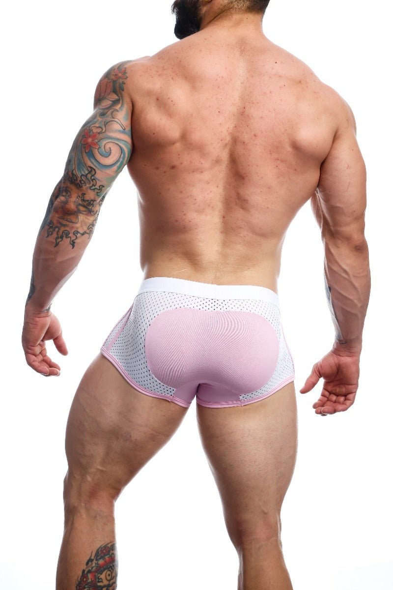 Pink and white mesh briefs with contoured padded rear panel shown from the back in malebasics spot new sexier trunk