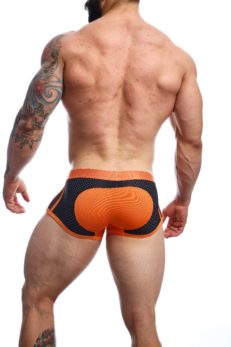 Malebasics spot new sexier trunk pink back view showing orange and black mesh briefs with padded orange panel