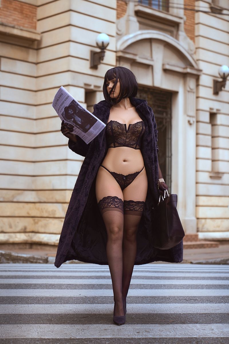 Mapale black lace two-piece lingerie set with strapless bra and thong, worn with top and stockings.