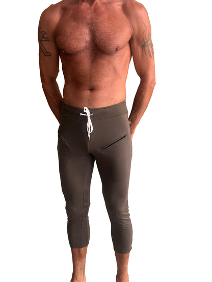 Dark gray mens 4/5 zipper pocket capri yoga pants with white drawstring waistband and side pockets for athletic use