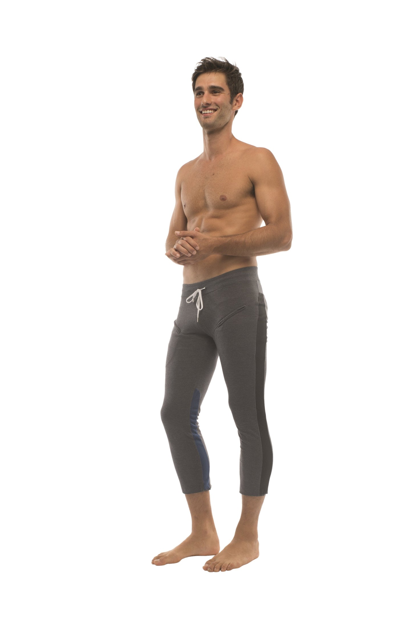 Mens charcoal gray capri yoga pants with white drawstring waistband and subtle side pockets for athletic use