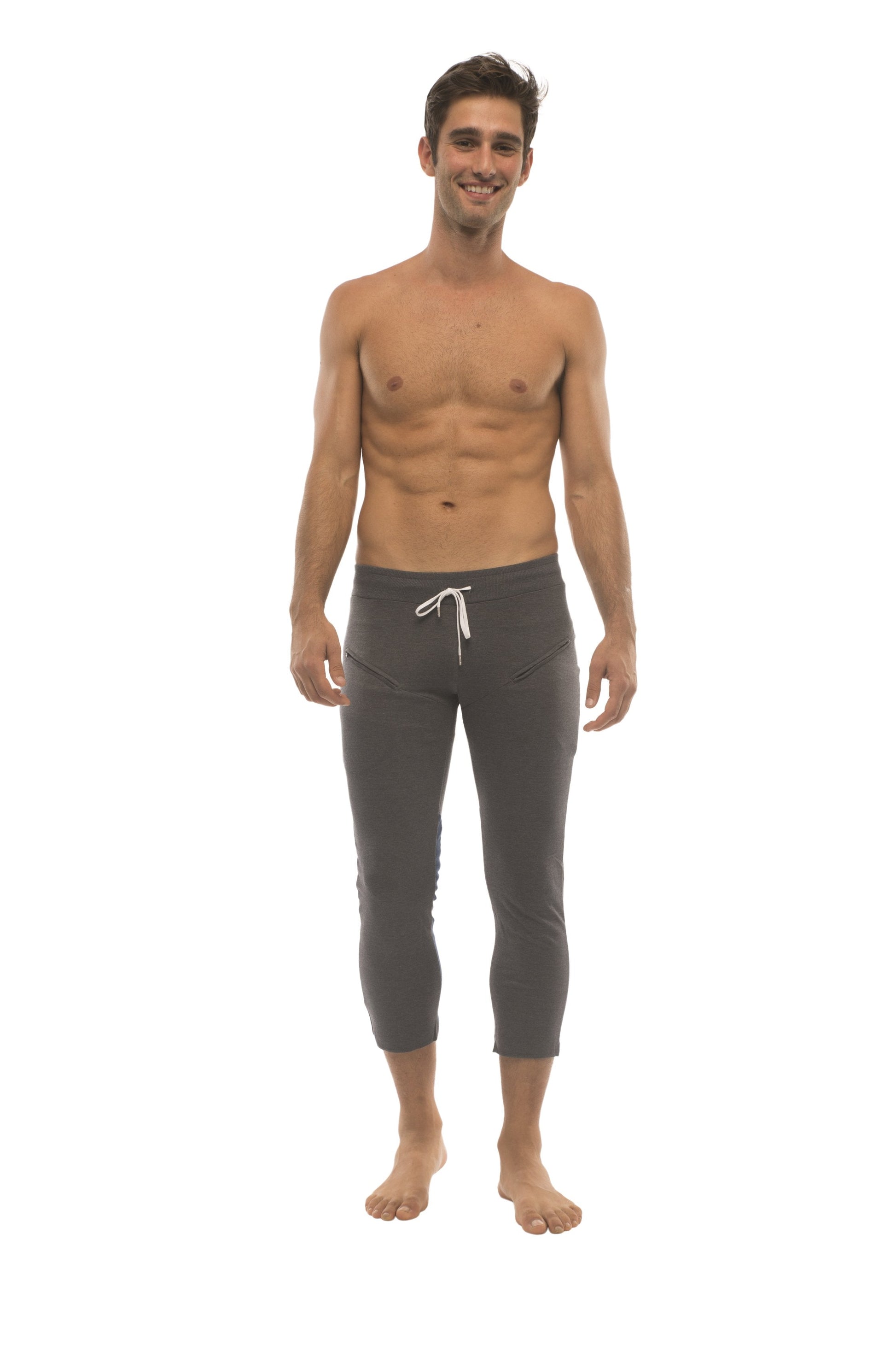 Mens charcoal capri yoga pants with white drawstring waistband and zipper pockets for active use