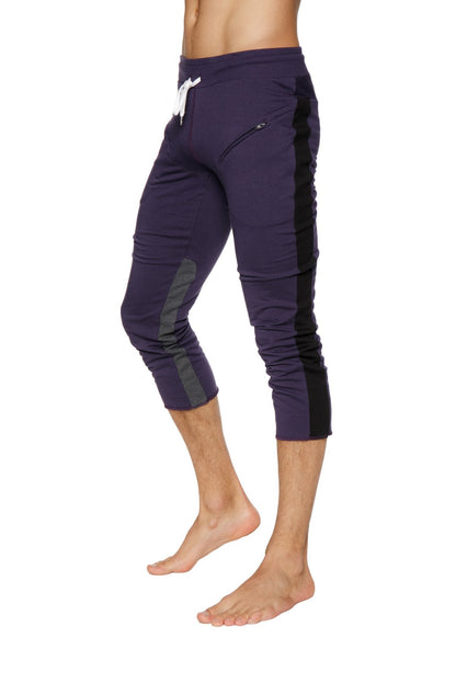 Mens eggplant capri yoga pants with black side panels and white drawstring waistband for athletic use
