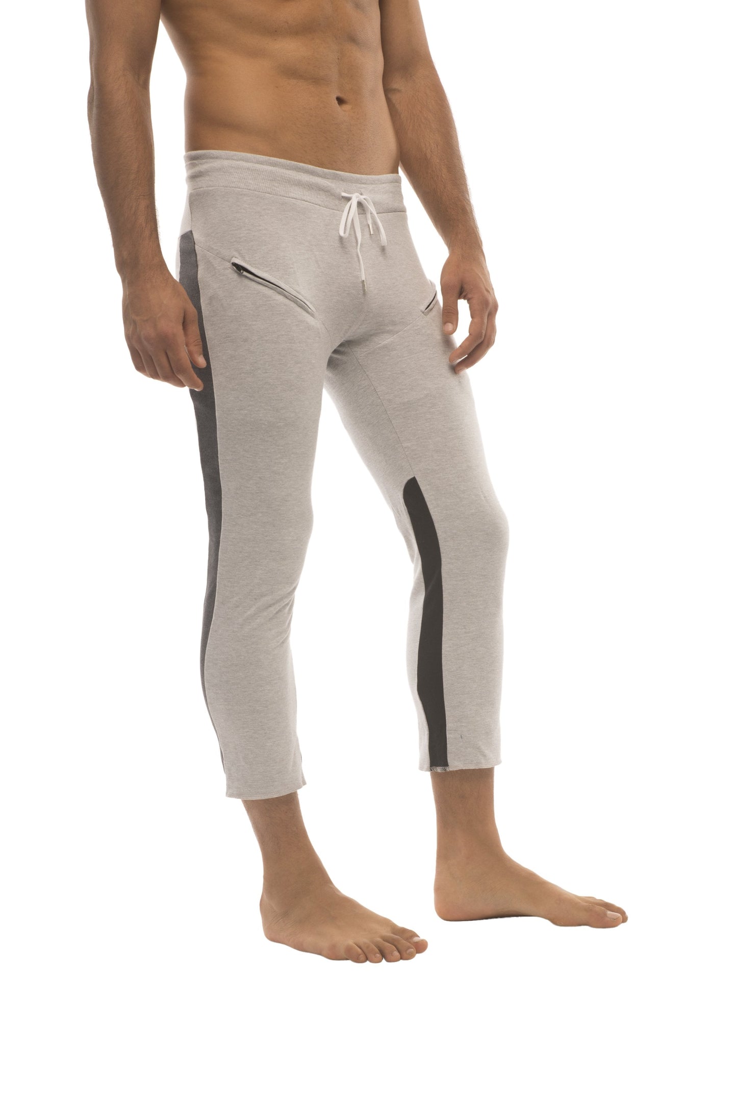 Mens 4/5 zipper pocket capri yoga pants in light gray with black side stripes and white drawstring waistband