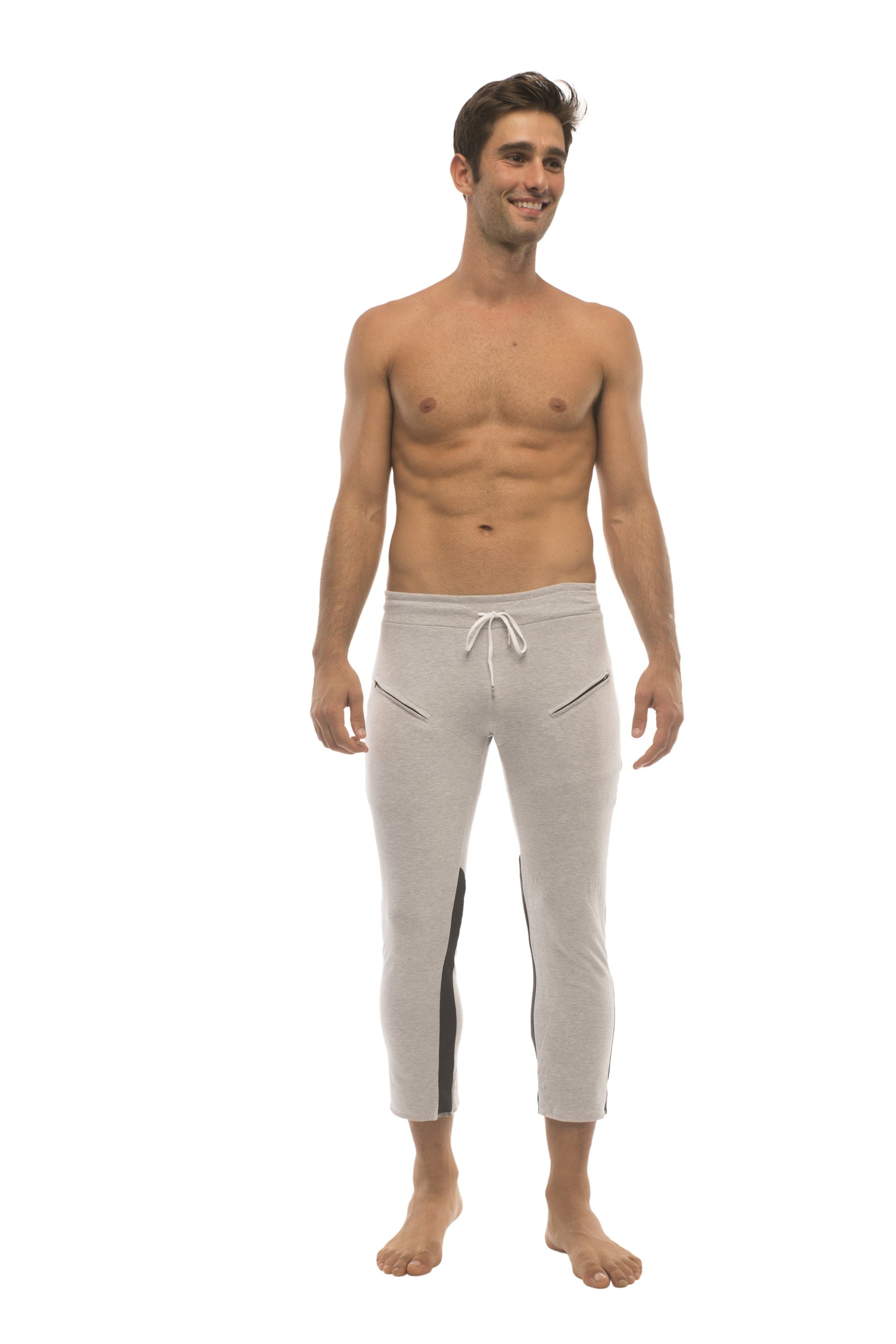 Mens 4/5 zipper pocket capri yoga pants in light gray with black side stripes and a white drawstring waistband