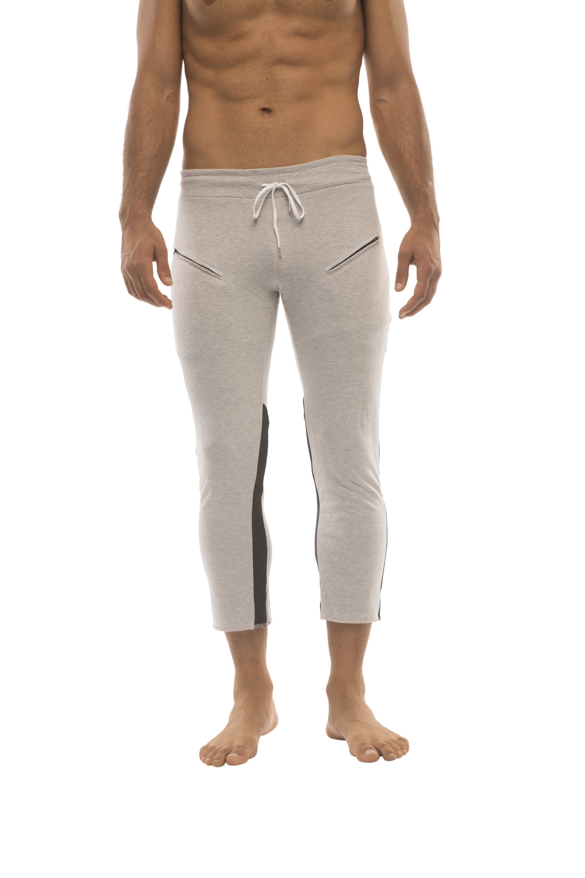 Mens light gray capri-length joggers with black side stripes and white drawstring waistband for yoga and casual wear