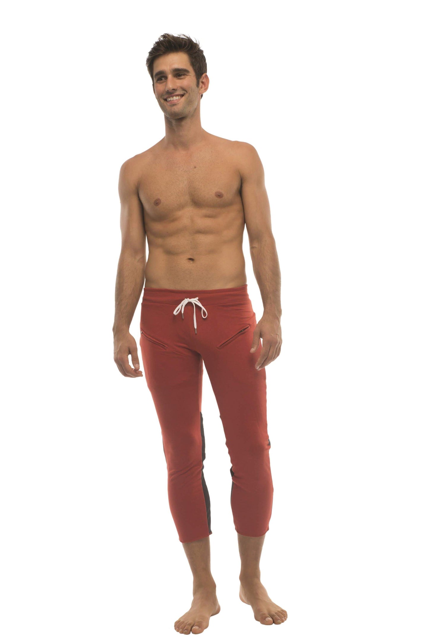 Mens 4/5 zipper pocket capri yoga pants in red with charcoal and black featuring white drawstring waistband and side panels