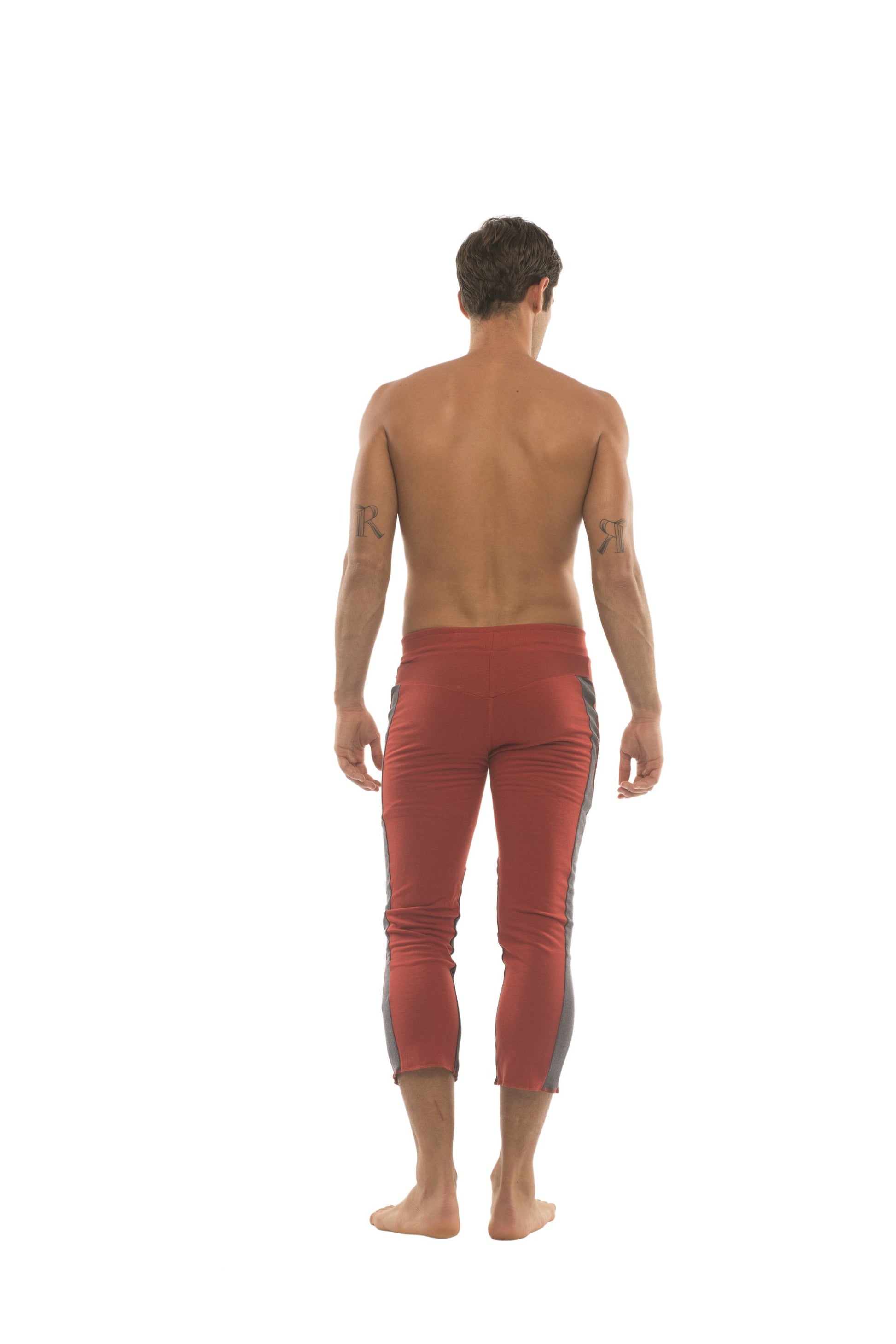 Mens 4/5 zipper pocket capri yoga pants in red with charcoal gray side panels designed for comfort and flexibility