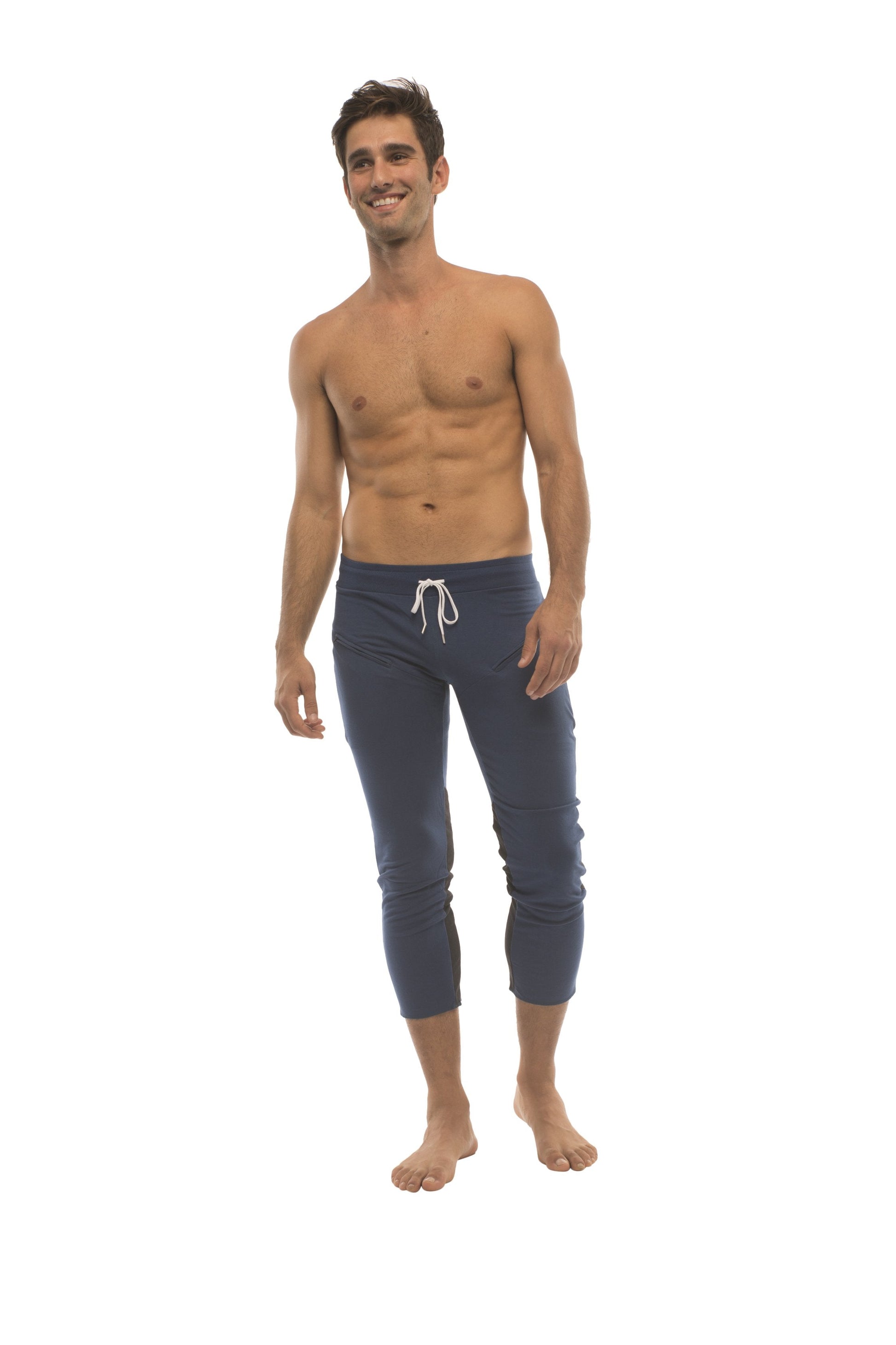 Navy blue capri-length mens yoga pants with white drawstring waistband and zipper pockets for activewear use