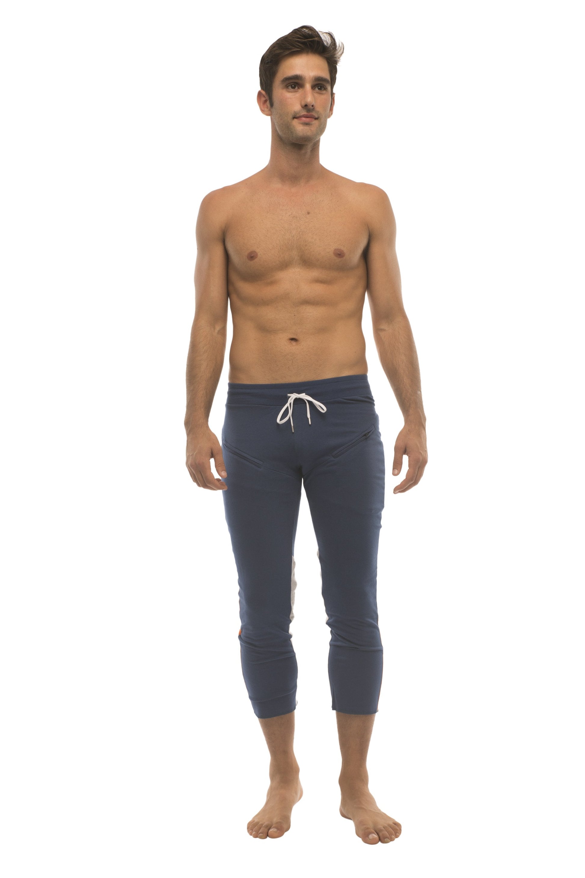 Navy blue mens capri yoga pants with white drawstring waistband and zipper pockets for active wear