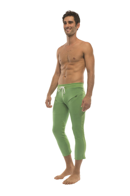 Men’s solid bamboo green capri yoga pants with white drawstring waistband and 4/5 zipper pockets