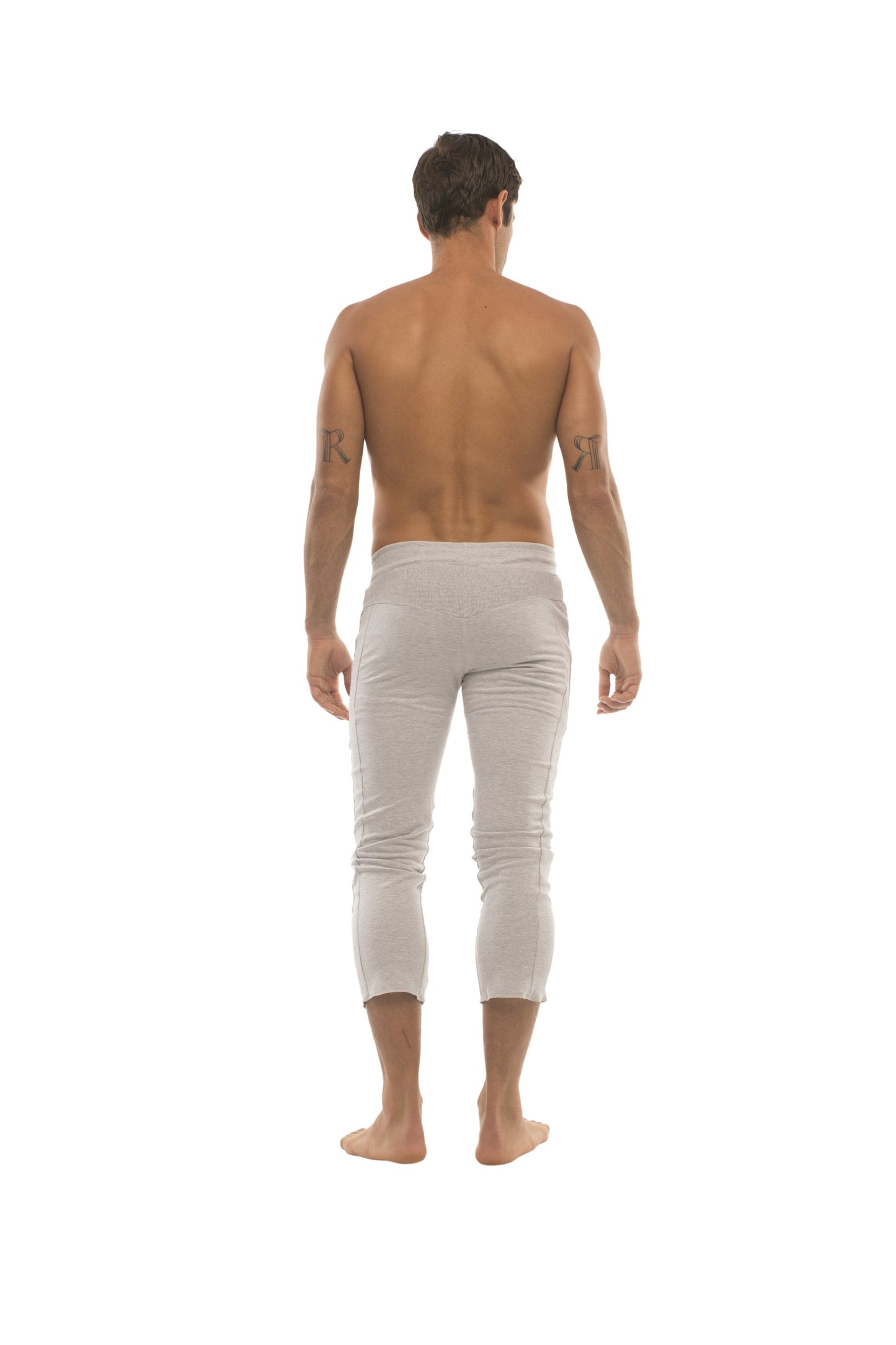 Mens light gray slim-fit capri yoga pants with smooth fabric and zipper pockets for active wear
