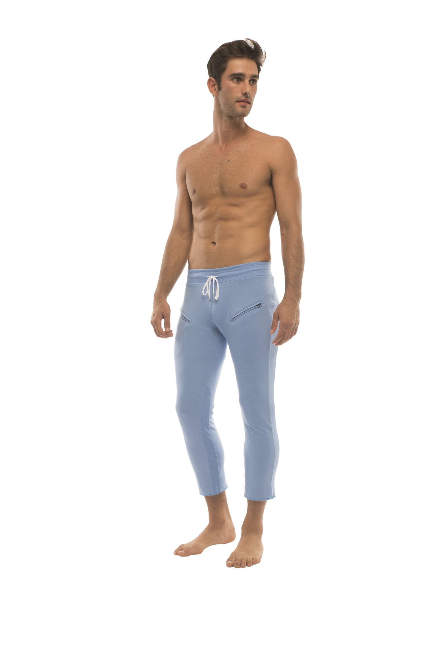 Mens ice blue form-fitting capri yoga pants with white drawstring waistband and subtle side zipper pockets