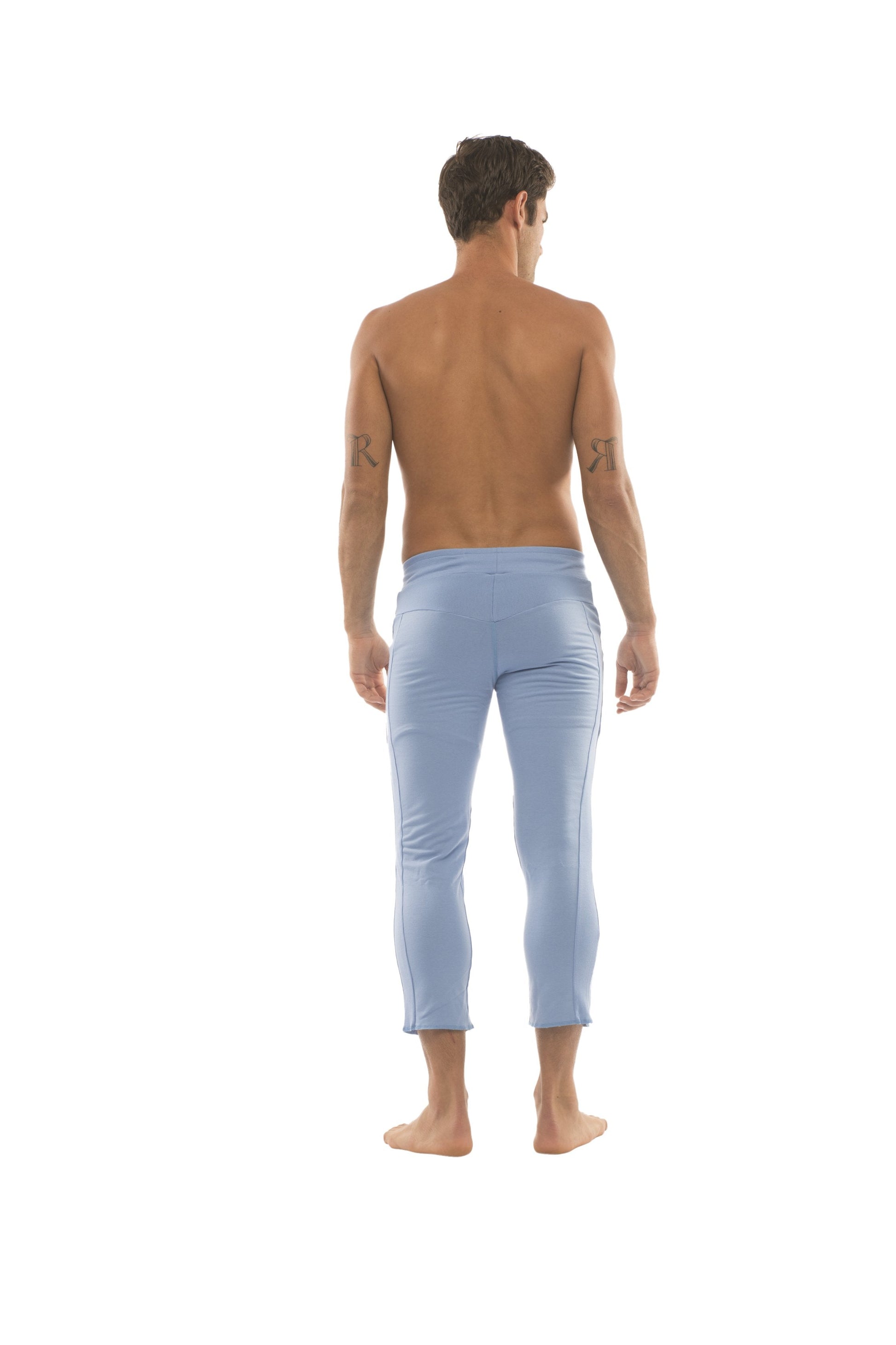 Men’s ice blue form-fitting capri yoga pants with smooth fabric and 4 5 zipper pockets for active use