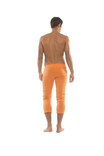 Mens solid orange 4/5 zipper pocket capri yoga pants made from breathable fabric for active wear