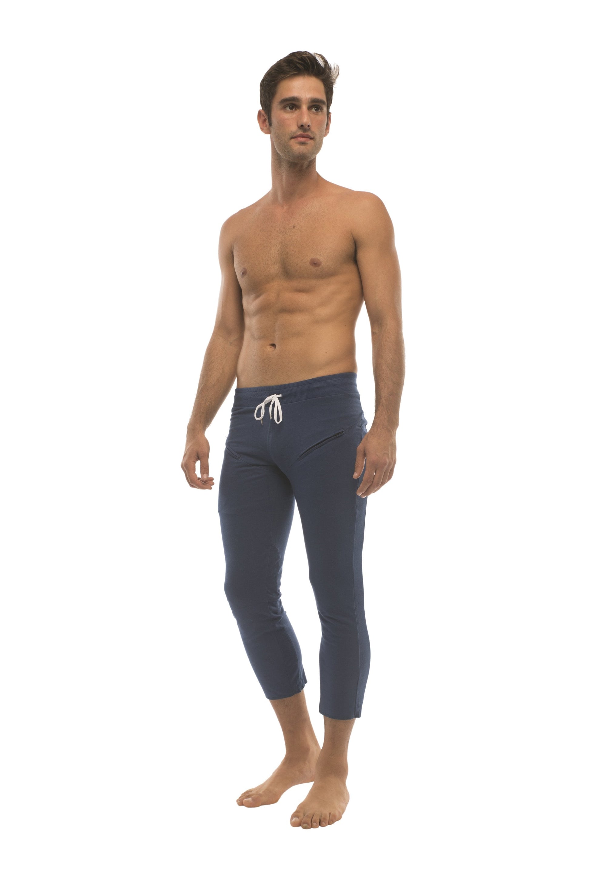Mens solid royal blue capri yoga pants with white drawstring waistband and zipper pockets for activewear