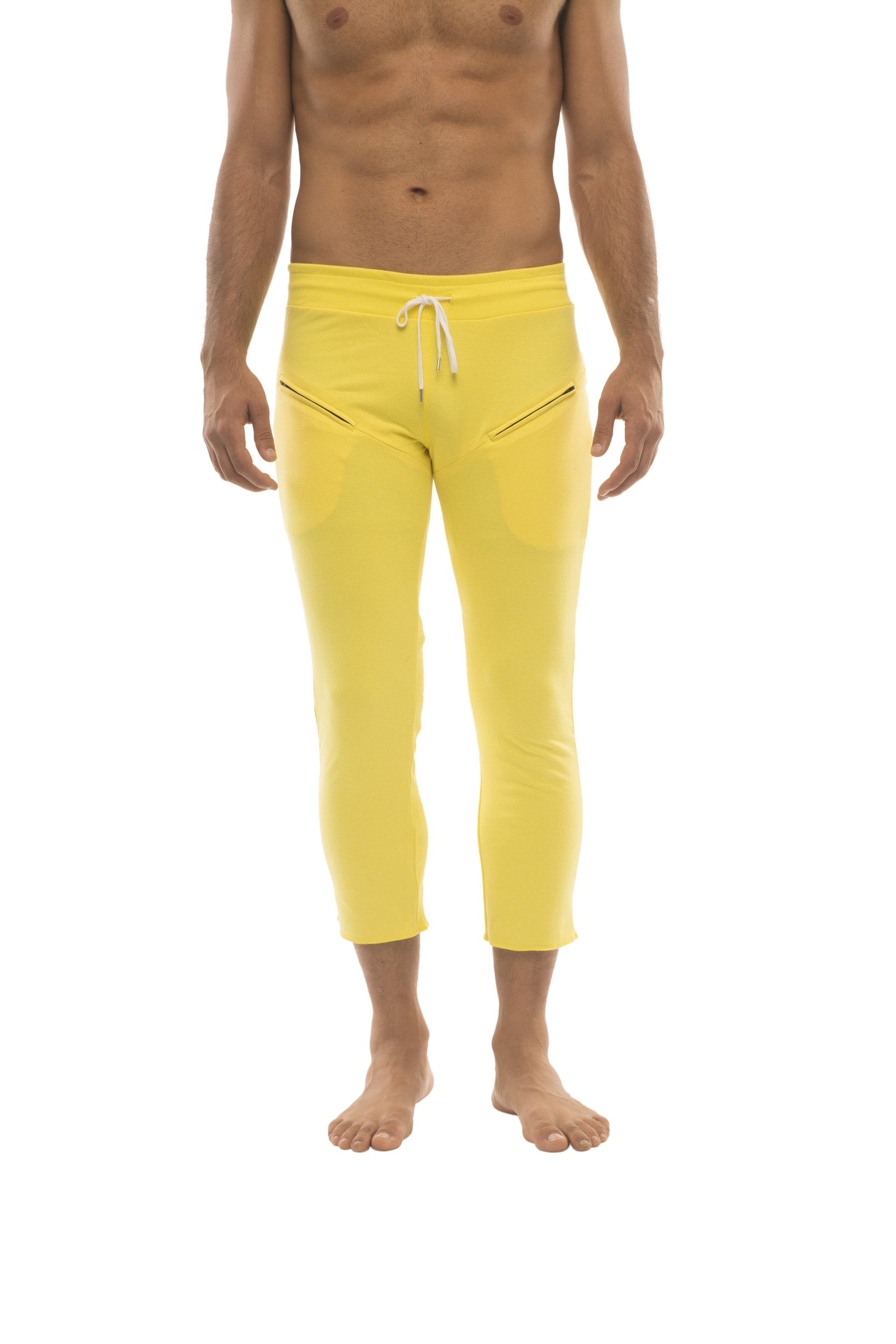 Mens solid yellow capri yoga pants with white drawstring waistband and diagonal zipper pockets
