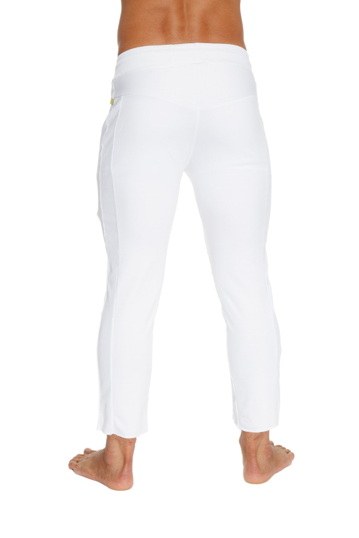 Back view of mens white slim-fit cargo capri yoga pants with subtle yellow logo on waistband and zipper pockets