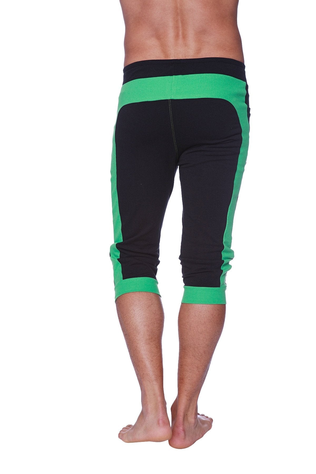 Mens cuffed yoga pants in black with neon green elastic waistband and ribbed cuffs designed for athletic wear