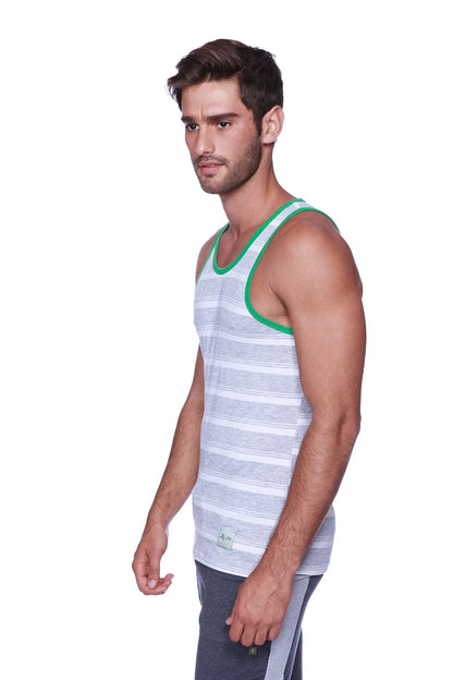 A men’s gray and white striped tank top with green trim paired with charcoal heather grey cuffed yoga pants