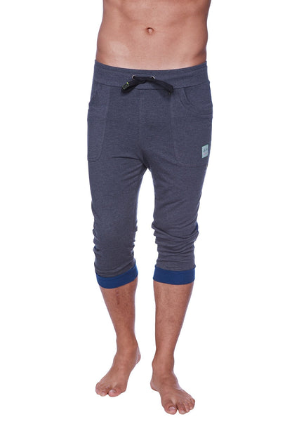 Men’s cuffed yoga pants in dark gray heather with navy blue waistband trim and cuffs for comfortable activewear