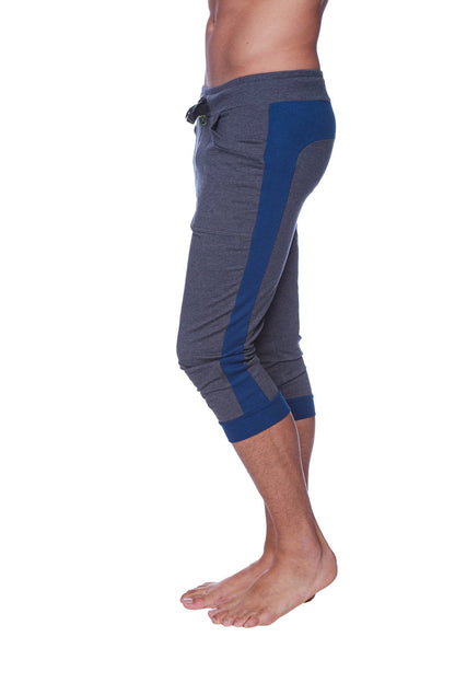Mens cuffed yoga pants in charcoal with royal blue featuring gray and blue athletic fabric and a drawstring waistband