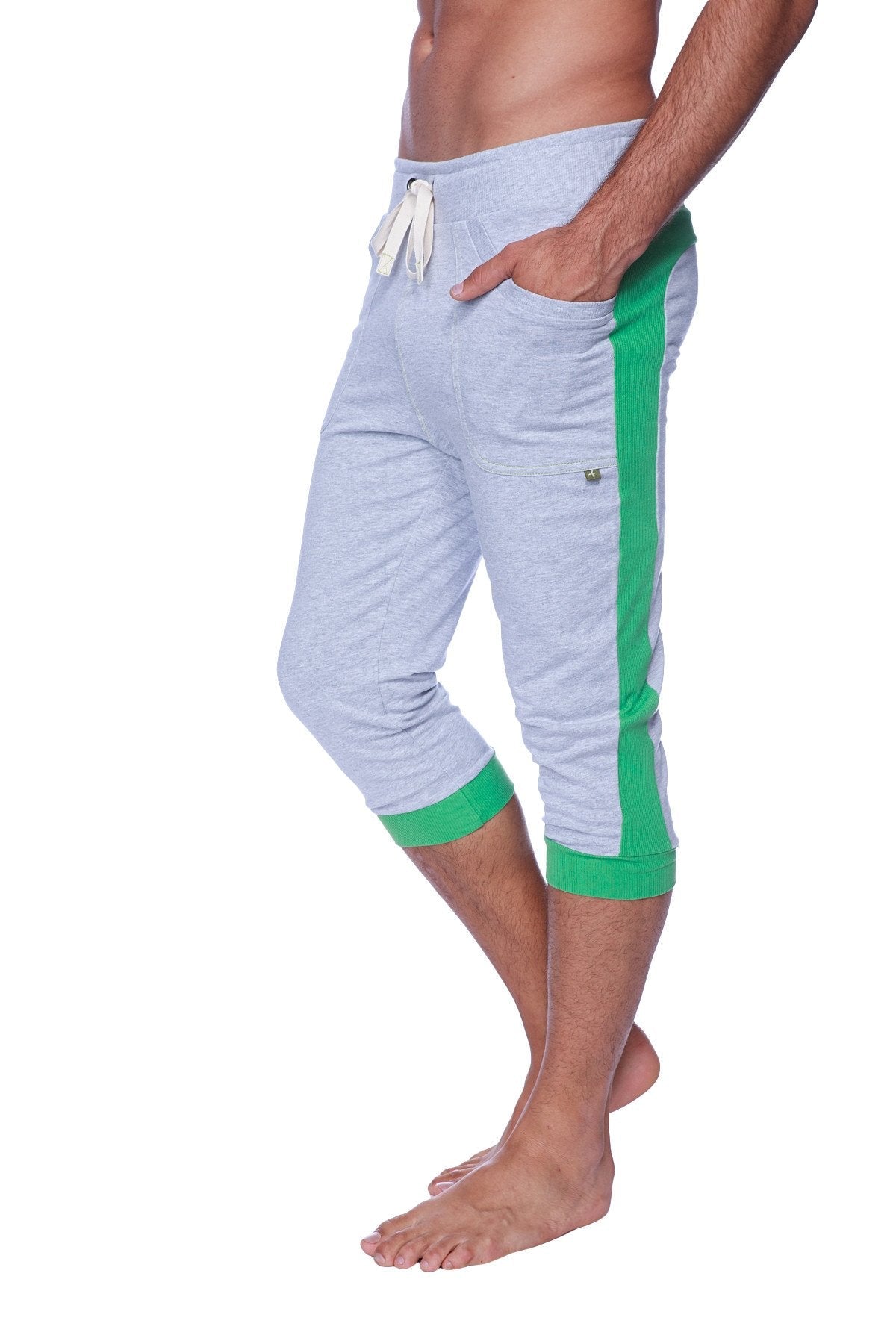Mens cuffed yoga pants in heather grey with vibrant green side stripes and cuffs featuring a drawstring waistband