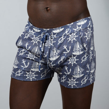 Nautical linen texture shorts in navy blue linen fabric with white anchors and ship wheels and an elastic waistband