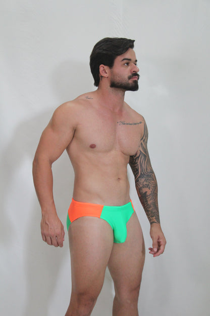 Neon curved swim brief in vibrant two-tone neon orange and lime green with sleek modern cut for swimming