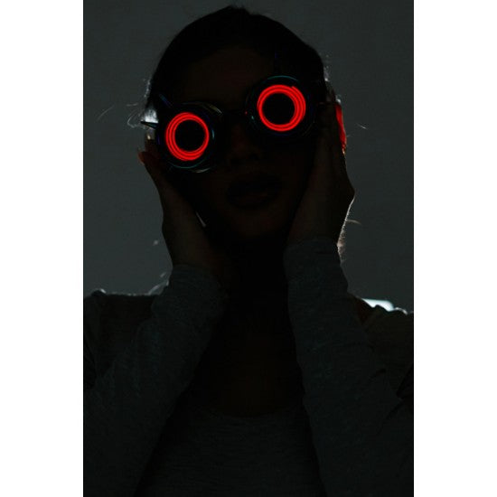 Neon light up goggles featuring red led-lit circular glowing lenses for vibrant nighttime use