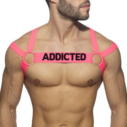 Bright pink neon multi band harness with black addicted text across the chest for edgy streetwear style