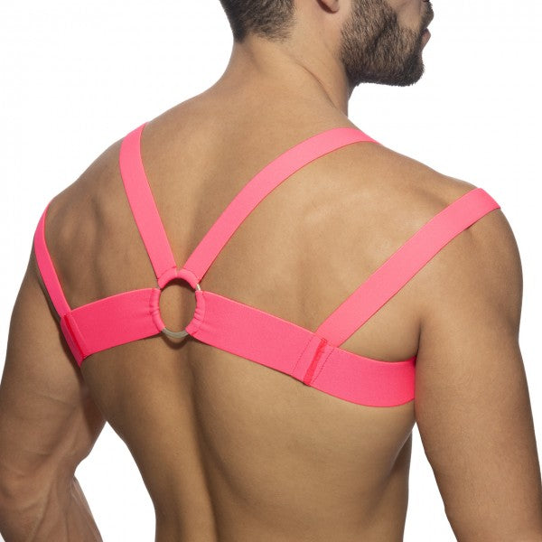 Bright pink elastic strap harness with central circular ring neon multi band harness for fashion or layering