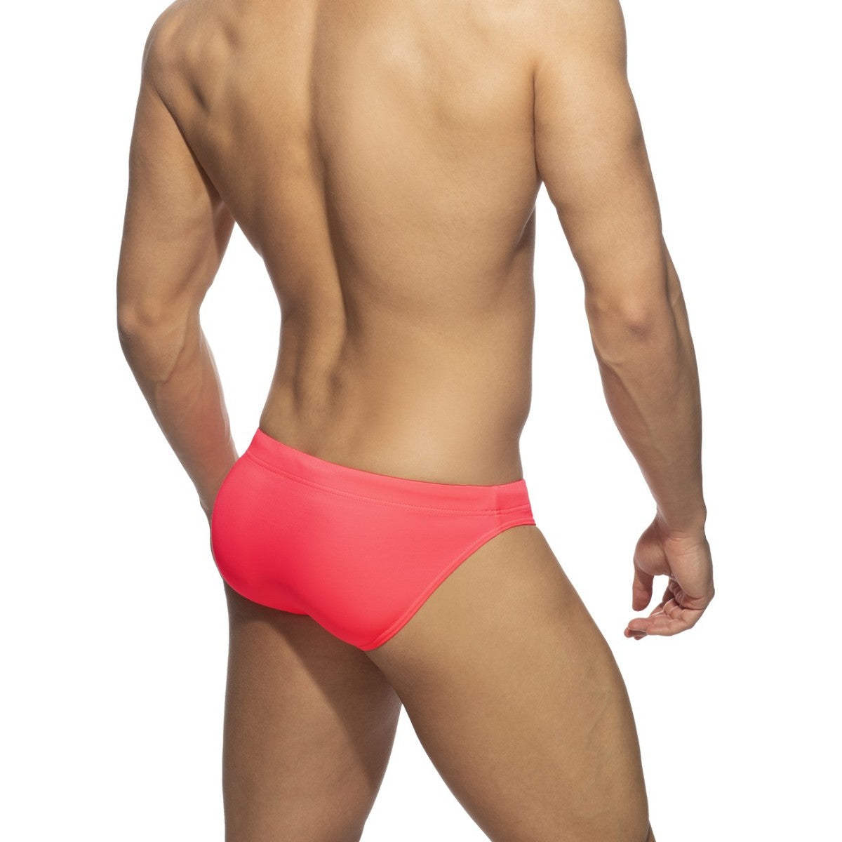 Bright coral neon swim bikini swim trunks with sleek form-fitting design perfect for beachwear