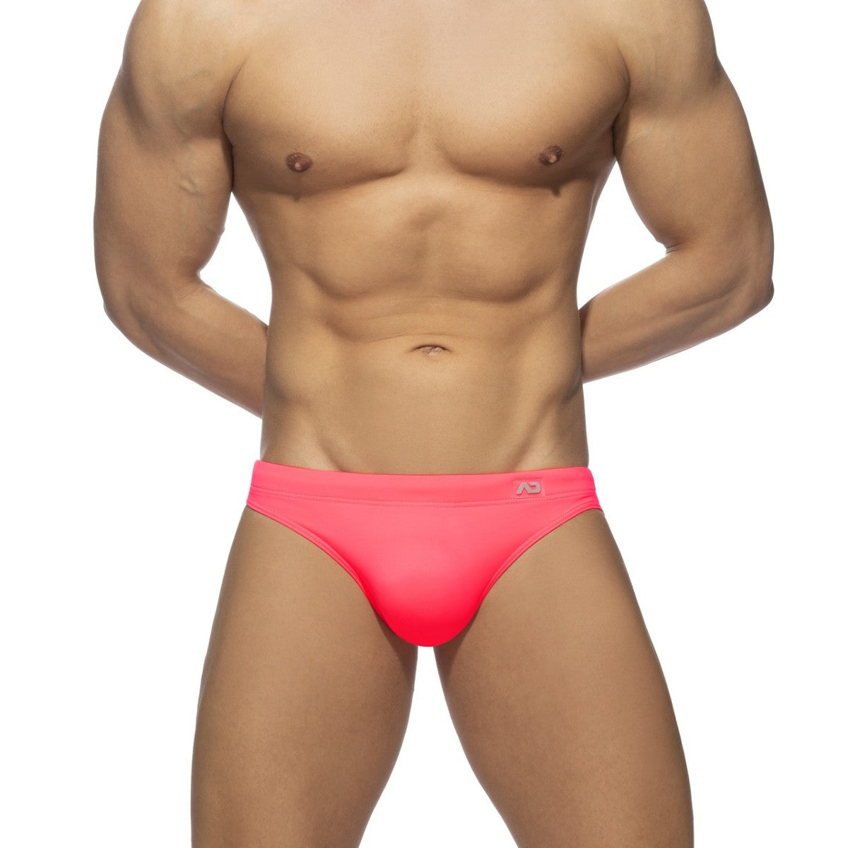 Neon swim bikini bright pink swim trunks with snug fit and small logo on waistband for stylish beachwear