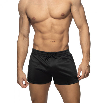 Black nexus button shorts with drawstring waistband and subtle side stripes for athletic use