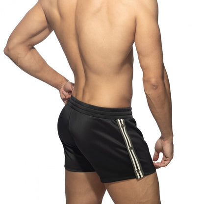 Black nexus button shorts with white and gray striped side panel designed for athletic use
