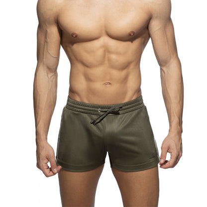 Olive green nexus button athletic shorts with white side stripes and drawstring waistband for active wear