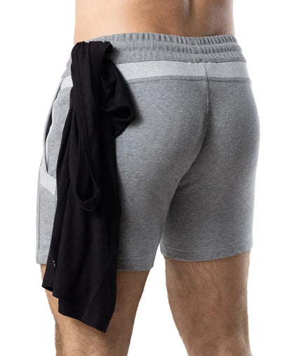 Back view of gray heathered nexus rugby short with ribbed waistband side pockets and black garment tied to back