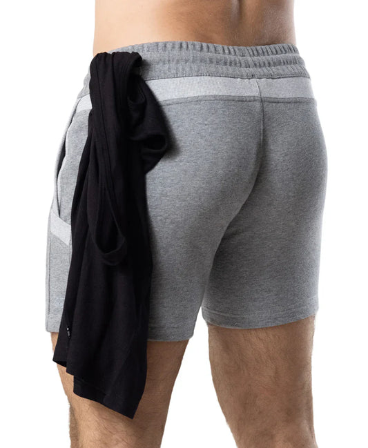 Back view of gray heathered nexus rugby short with ribbed waistband side pockets and black garment tied to back